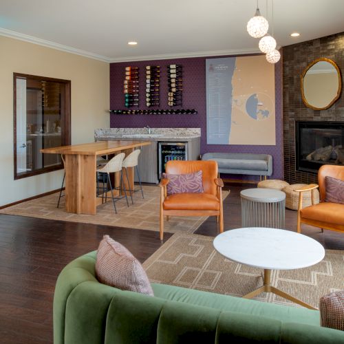 A cozy living room with a warm, modern layout: sofa, armchairs, coffee table, and a bookshelf; warm lighting and decorative art.